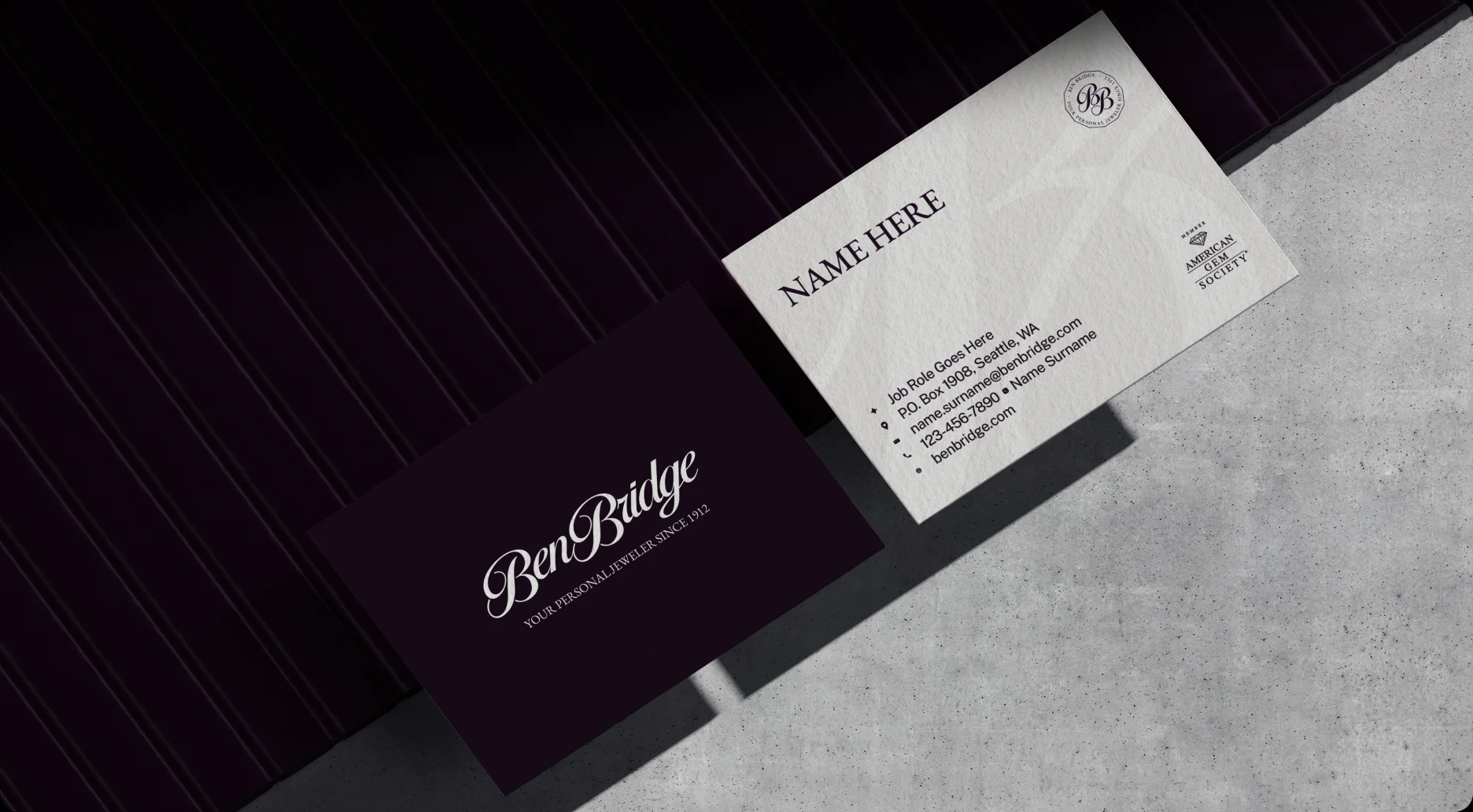 Ben Bridge business cards in aubergine and white