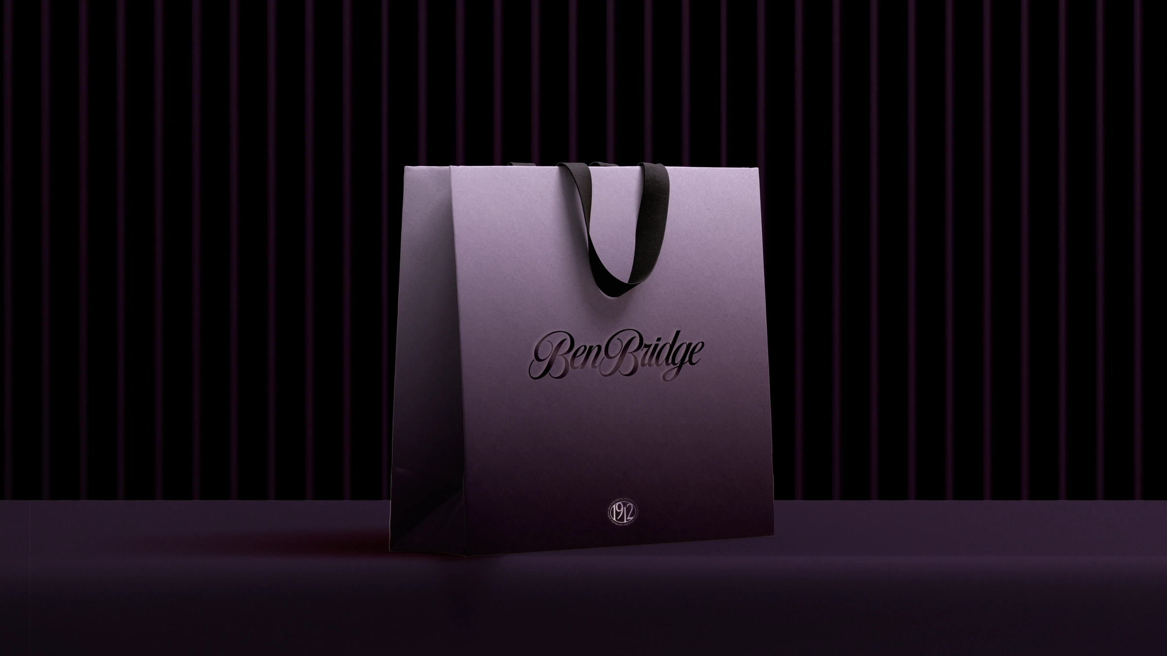 A lilac Ben Bridge shopping bag with the script wordmark and 1912 seal
