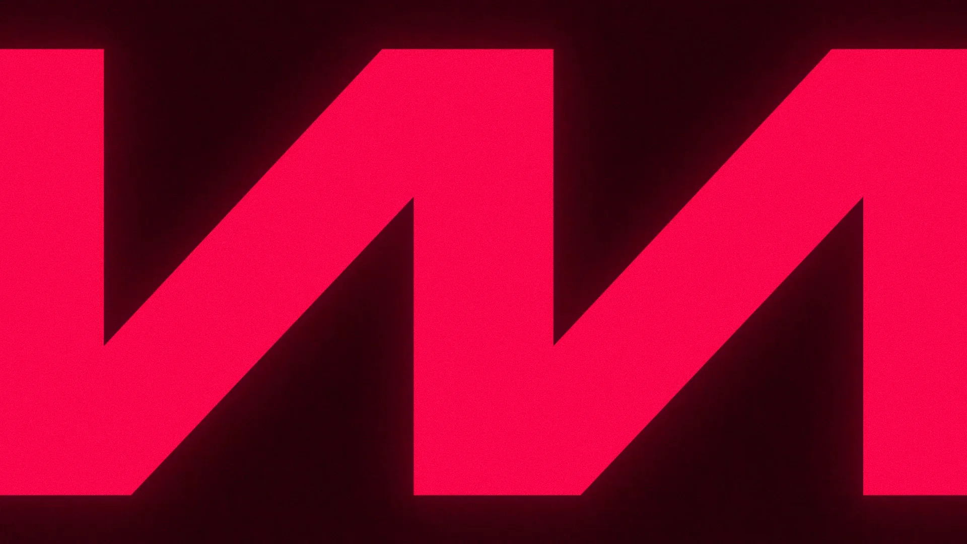 The Wow Media W mark cropped large in glowing red